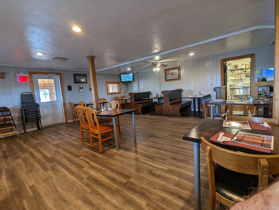 Casual bar and grill dining room with tables and chairs.